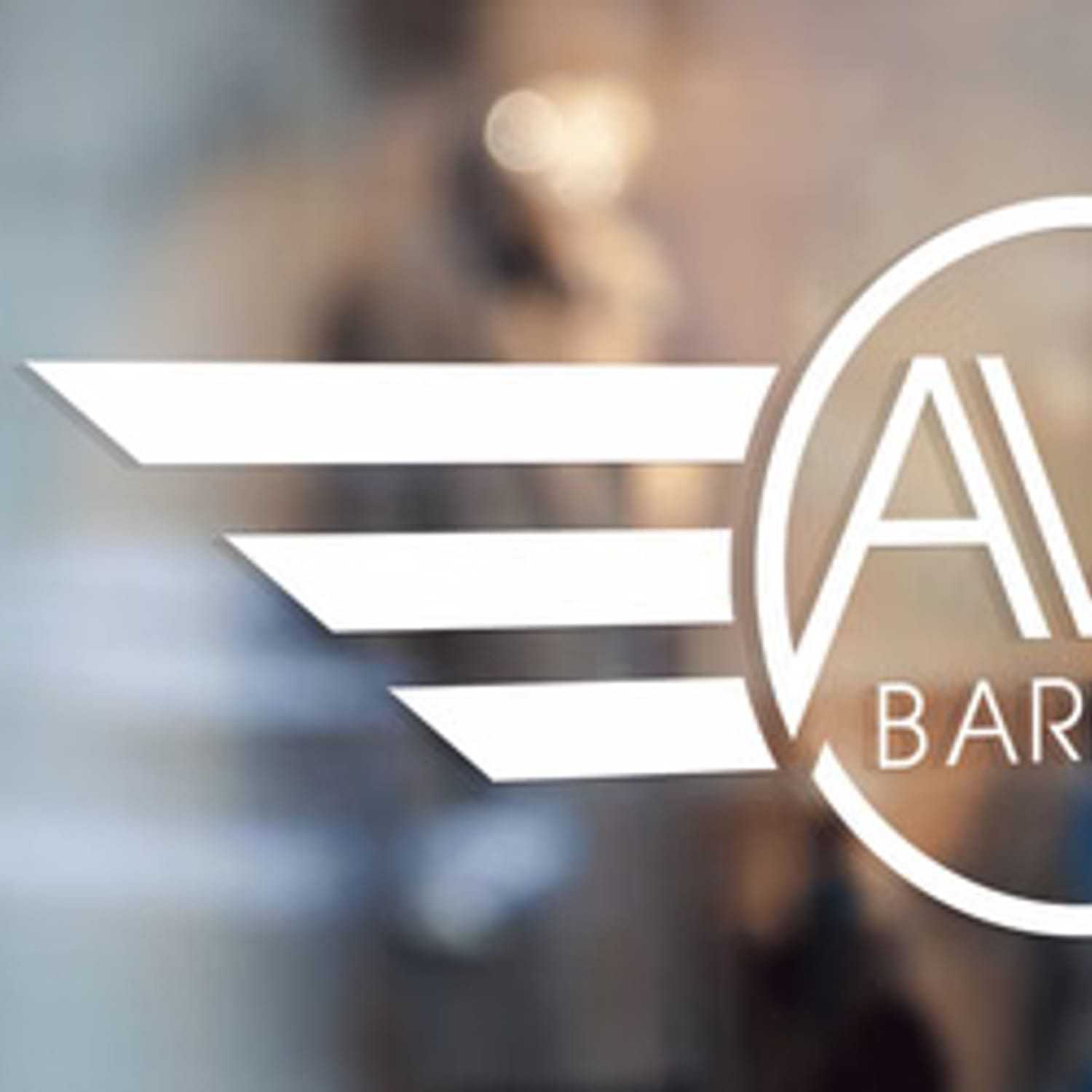 Portrait of Tommy, a professional stylist at Av8 Barbers, showcasing their expertise and style.