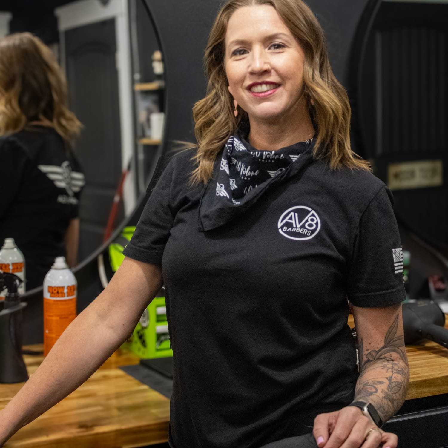 Portrait of Alisha, a professional stylist at Av8 Barbers, showcasing their expertise and style.